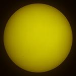 This is our Sun. The little black dots in the bottom left are the silhouettes of the Space Shuttle Atlantis and the Hubble Space Telescope on May13...